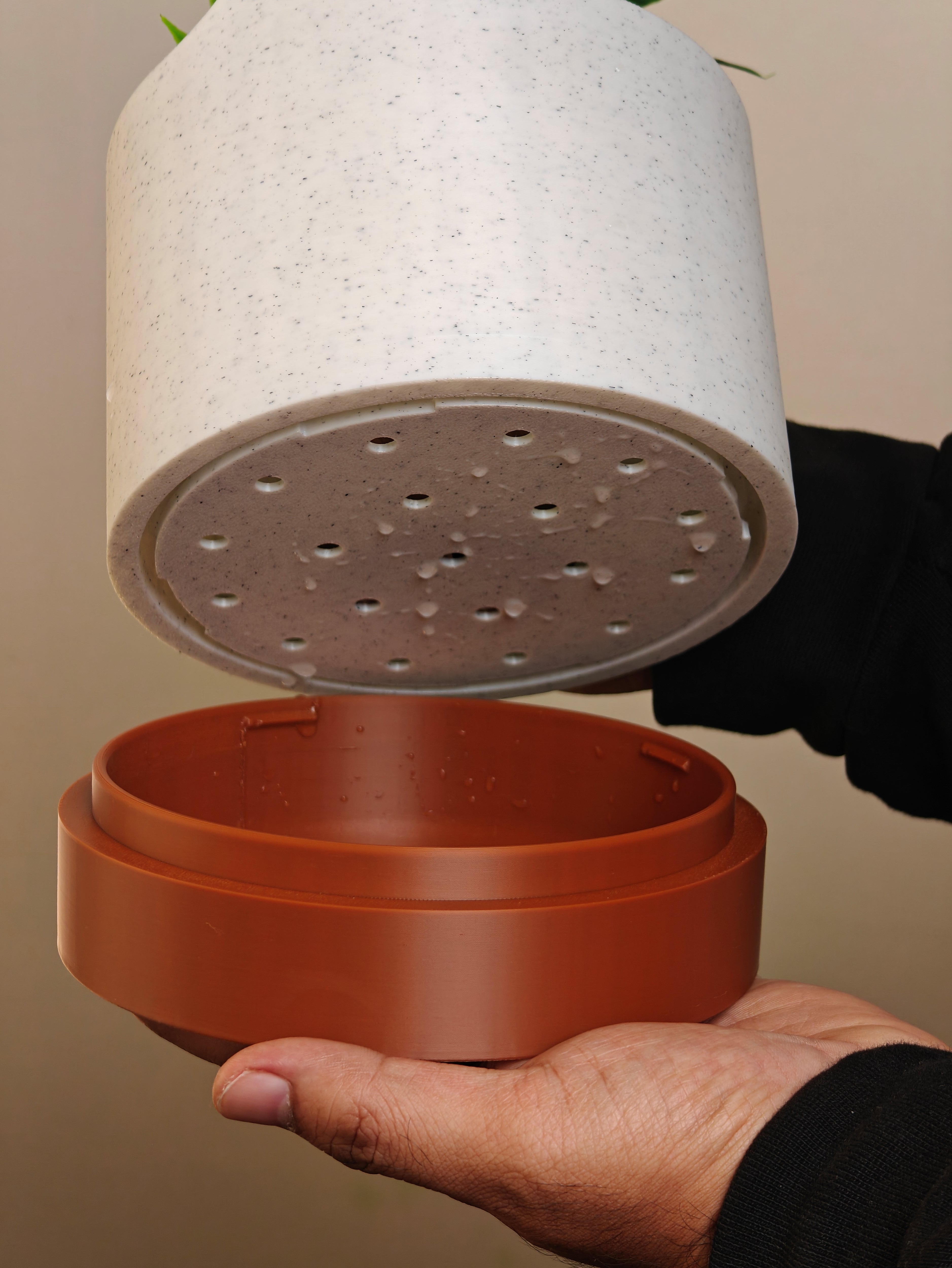 Aura Planter with drip tray and light closing cap, highlighting its thoughtful design and functionality